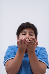 Image showing kid blowing confetti