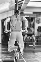 Image showing man doing exercises parallel bars