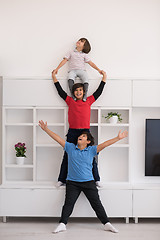 Image showing young boys posing line up piggyback