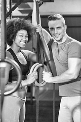 Image showing Portrait of multiethnic couple  after workout at gym