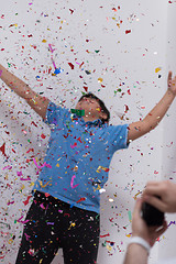 Image showing kid blowing confetti