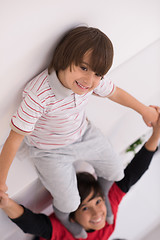 Image showing young boys posing line up piggyback top view