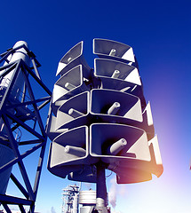 Image showing Isolated loudspeakers with a natural blue background  