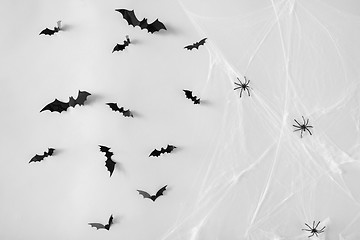 Image showing halloween decoration of bats and spiders on web