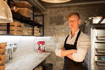 Image showing chef or baker in apron at bakery kitchen