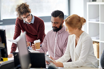 Image showing business team with tablet pc in office