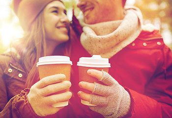 Image showing close up of happy couple with coffee in autumn