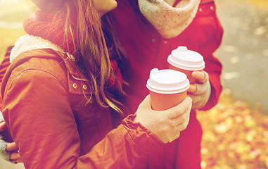 Image showing close up of happy couple with coffee in autumn