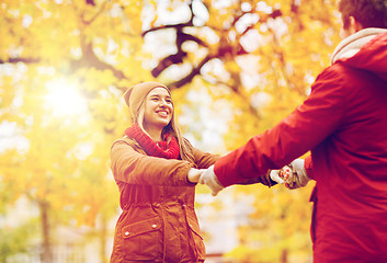 Image showing happy young couple having fun in autumn park