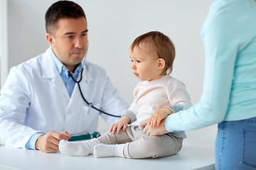 Image showing happy woman with baby and doctor at clinic