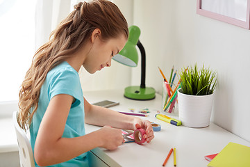 Image showing happy girl making something at home