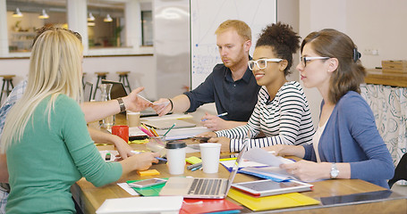 Image showing Cheerful team working at table