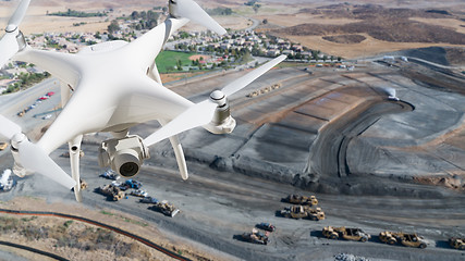 Image showing Unmanned Aircraft System (UAV) Quadcopter Drone In The Air Over 