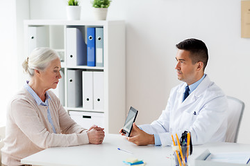 Image showing senior woman and doctor with tablet pc at hospital