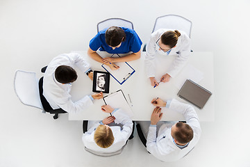 Image showing doctors with jaw x-ray on tablet pc at clinic