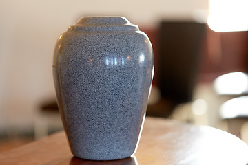 Image showing cremation urn on table in church