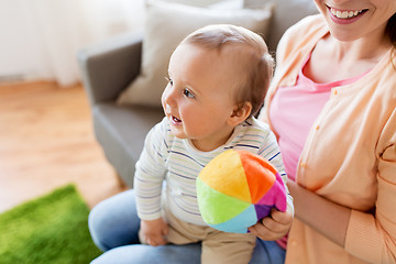 Image showing happy young mother with little baby at home