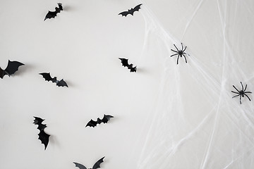 Image showing halloween decoration of bats and spiders on web