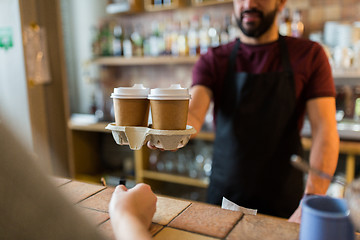 Image showing man or bartender serving customer at coffee shop