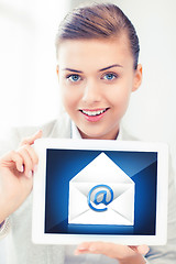 Image showing businesswoman holding tablet pc with email sign