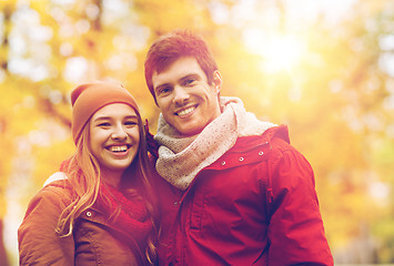 Image showing happy young couple walking in autumn park