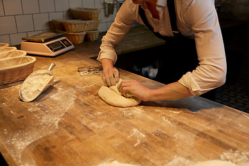 Image showing chef or baker cooking dough at bakery