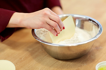 Image showing chef with flour in bowl making batter or dough