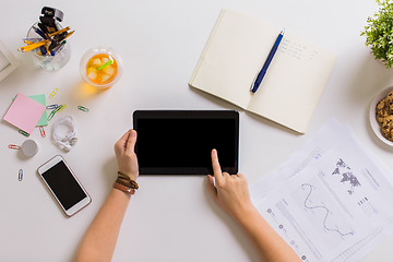 Image showing hands with tablet pc and notebook at office table