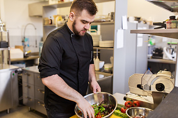 Image showing chef cook making food at restaurant kitchen