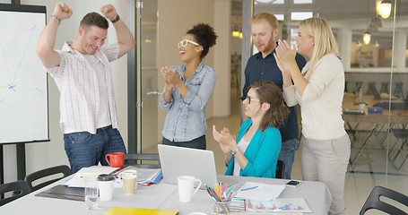 Image showing Cheerful coworkers celebrating