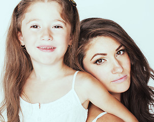 Image showing young mother with little cute daughter emotional posing on white