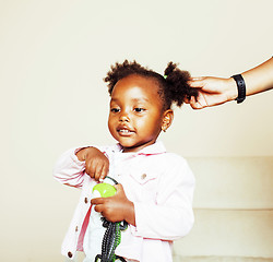 Image showing little cute sweet african-american girl playing happy with toys 