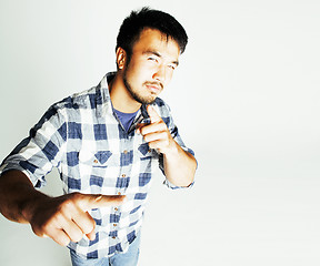 Image showing young cute asian man on white background gesturing emotional, po