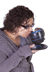 Image showing Woman Drinking Coffee Standing Up