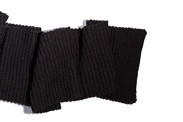 Image showing knitted black scarf isolated on white background