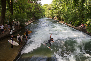 Image showing Surfer surfing an artificial wave in Munich city center, Germany.