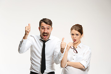 Image showing Successful business couple at the office looking at camera