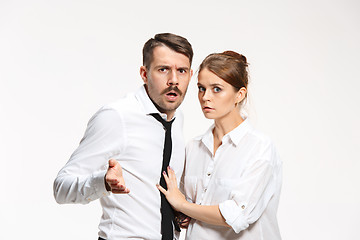 Image showing Successful business couple at the office looking at camera