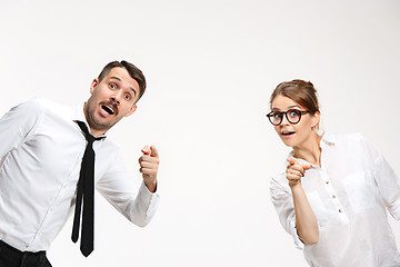 Image showing Successful business couple at the office looking at camera