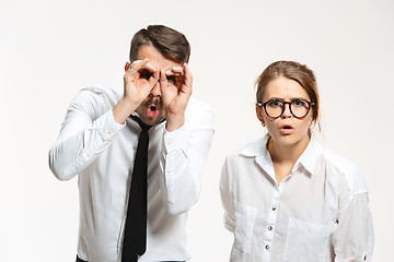 Image showing Successful business couple at the office looking at camera