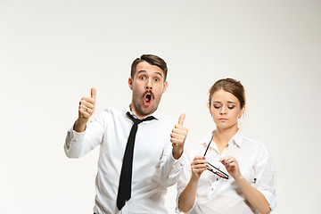 Image showing Successful business couple at the office looking at camera