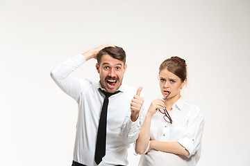 Image showing Successful business couple at the office looking at camera