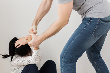 Image showing unhappy woman suffering from domestic violence