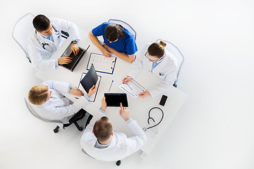 Image showing doctors with x-ray and cardiogram at hospital