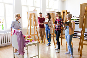 Image showing students and teacher with still life at art school