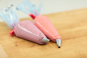 Image showing confectionery bags with macaron batter or cream