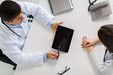 Image showing smiling doctor and young woman meeting at hospital