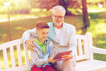 Image showing grandfather and boy with tablet pc at summer park