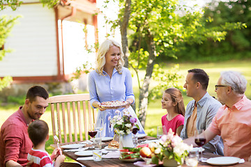 Image showing happy family having dinner or summer garden party