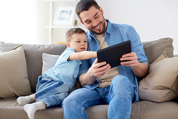 Image showing father and son with tablet pc playing at home